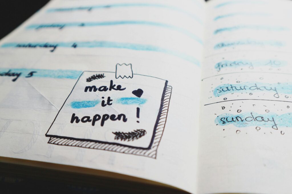 Close-up view of a planner page with motivational text and colorful designs. Business in Mainland UAE