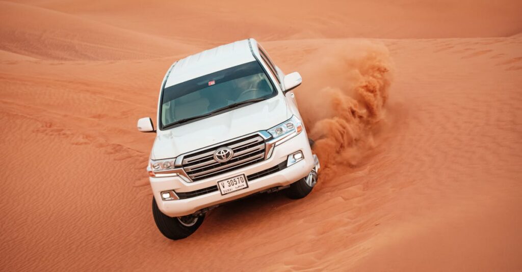 pexels-photo-4781948-4781948 A Toyota Land Cruiser navigating a challenging desert dune, showcasing off-road capabilities.