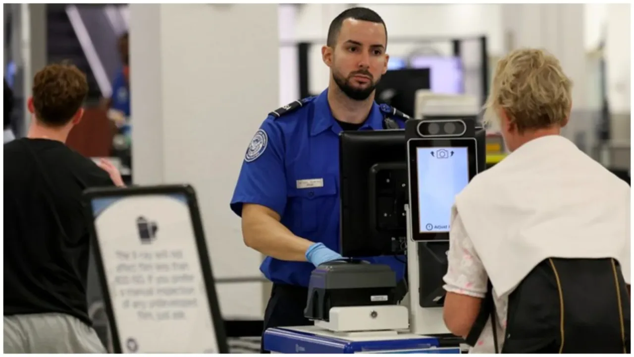 A TSA agent works in a TSA Pre checkpoint at the Miami International Airport. TSA airport security